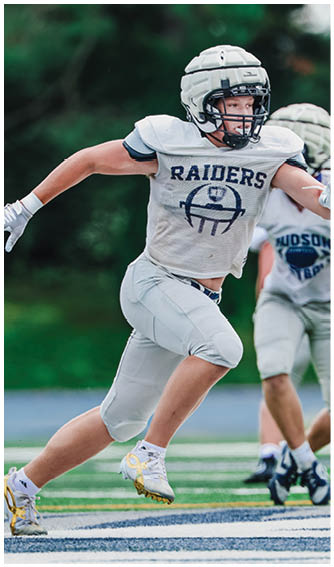 A football player running on the field. Description generated by AI