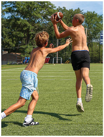 A football player running on the field. Description generated by AI