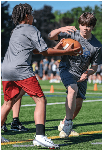 A football player running on the field. Description generated by AI