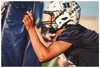 A football player is sliding on the ground. Description generated by AI
