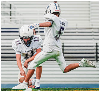 A football player running on the field. Description generated by AI