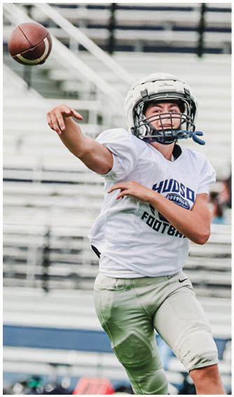 A football player running on the field. Description generated by AI