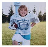 Two football players wearing black jerseys and holding hands. Description generated by AI