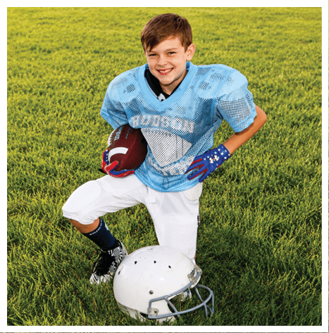 Two football players wearing black jerseys and holding hands. Description generated by AI