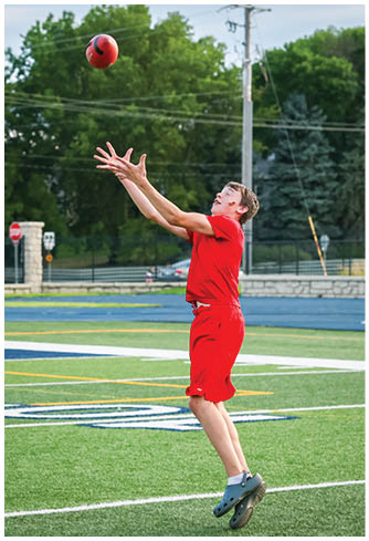 A football player running on the field. Description generated by AI