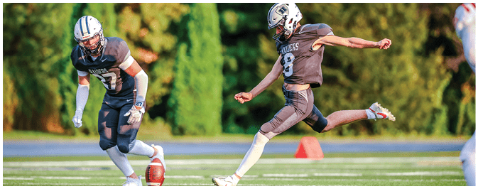 A football player is sliding on the ground. Description generated by AI