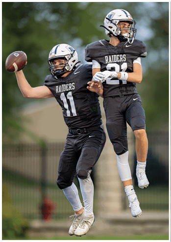 A football player running on the field. Description generated by AI