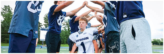 A football player is sliding on the ground. Description generated by AI