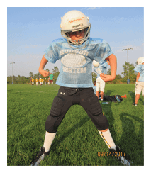 Two football players wearing black jerseys and holding hands. Description generated by AI