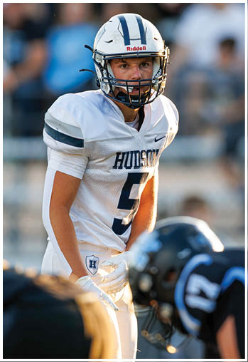 A football player running on the field. Description generated by AI