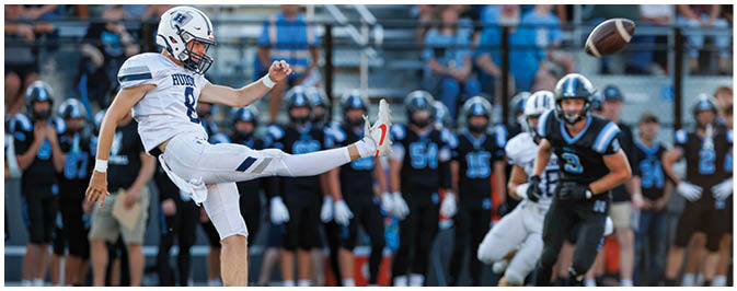 A football player is sliding on the ground. Description generated by AI