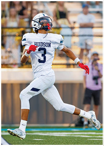 A football player running on the field. Description generated by AI