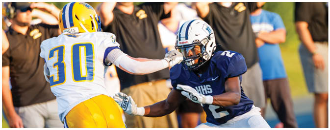 A football player is sliding on the ground. Description generated by AI
