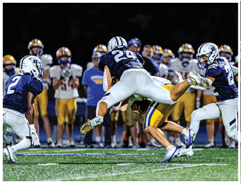 A football player running on the field. Description generated by AI