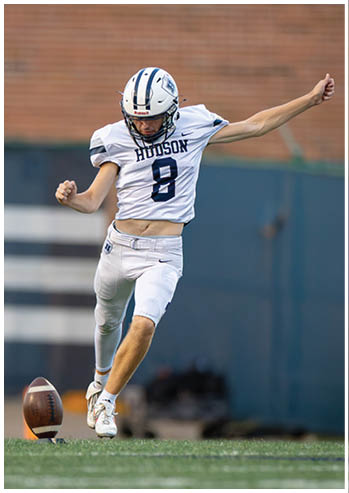 A football player running on the field. Description generated by AI