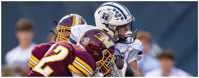 A football player is sliding on the ground. Description generated by AI