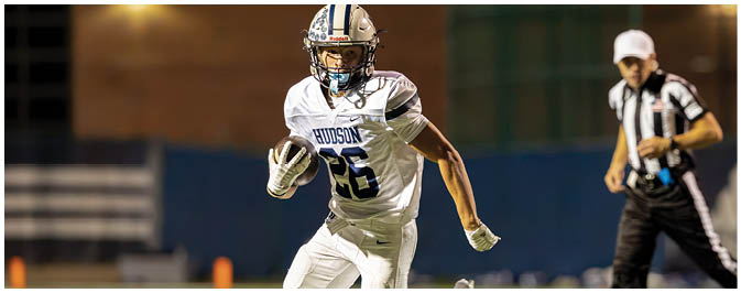 A football player is sliding on the ground. Description generated by AI