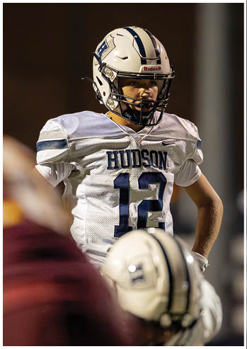 A football player running on the field. Description generated by AI