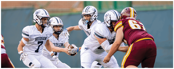 A football player is sliding on the ground. Description generated by AI