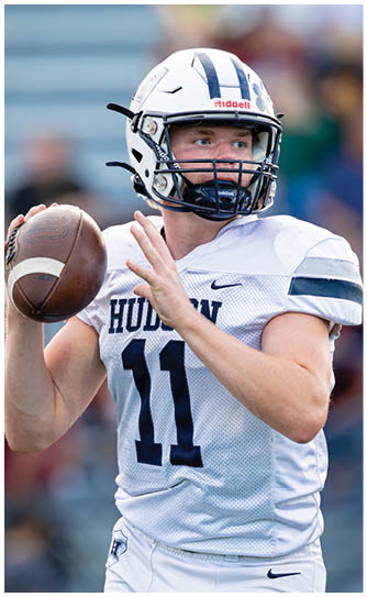 A football player catching a ball. Description generated by AI