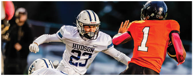 A football player is sliding on the ground. Description generated by AI