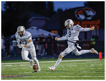 A football player running on the field. Description generated by AI