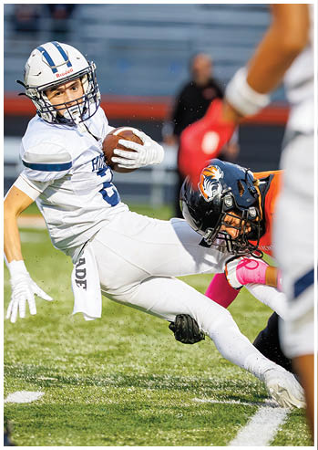 A football player running on the field. Description generated by AI