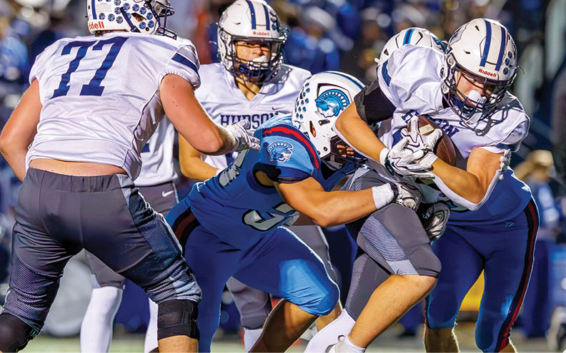 A football player wearing a blue and white jersey with the number 11 on it. Description generated by AI
