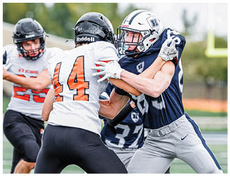 A group of football players on a field. Description generated by AI