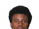 A young man wearing a white jersey with the number 10 on it. Description generated by AI