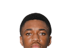 A young man wearing a white jersey with the number 10 on it. Description generated by AI