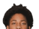 A young man wearing a white jersey with the number 10 on it. Description generated by AI