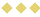 Three yellow diamond-shaped crackers with small round holes arranged in a grid pattern. Description generated by AI