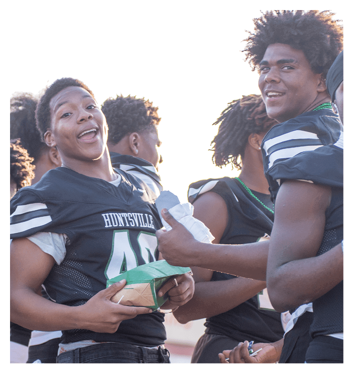 A group of football players walking on the field. AI generated content