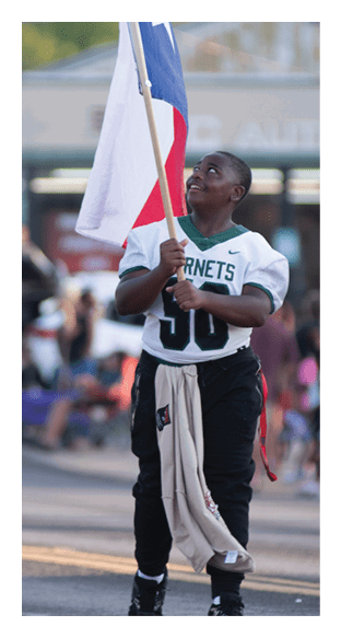 A man in a green shirt and black pants is preparing to throw a football. AI generated content