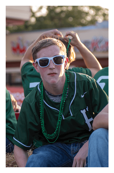 A young man wearing a football jersey with the name Vista on the back. AI generated content