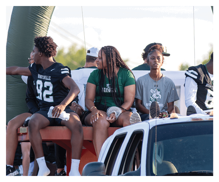 A young man wearing a football jersey with the name Vista on the back. AI generated content