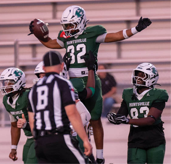 A group of football players celebrating a victory. AI generated content