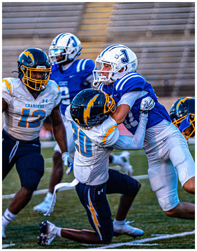 A football player wearing a blue jersey with the number 58 on it. Description generated by AI