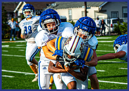 A group of football players on a field. Description generated by AI