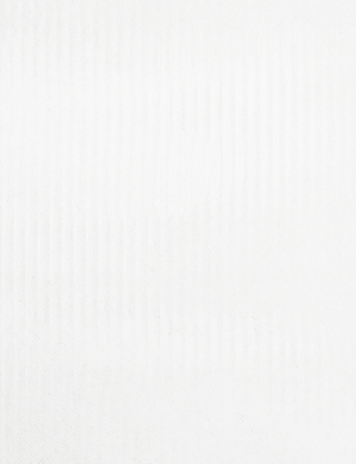 White cloth with a pattern. Description generated by AI