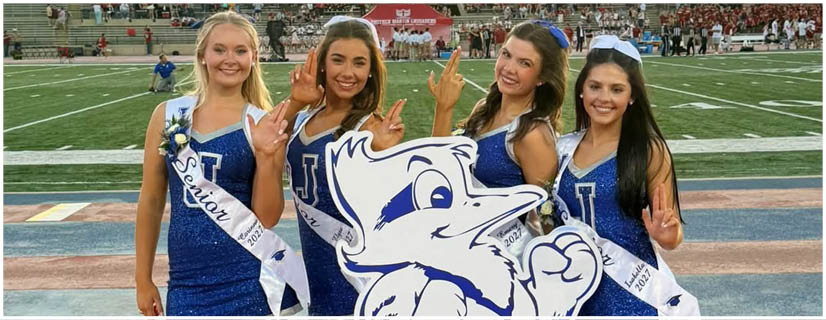 A football player wearing a blue and white uniform. Description generated by AI