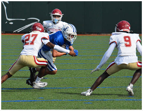 A group of football players on a field. Description generated by AI
