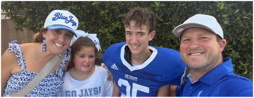 A football player wearing a blue and white uniform. Description generated by AI