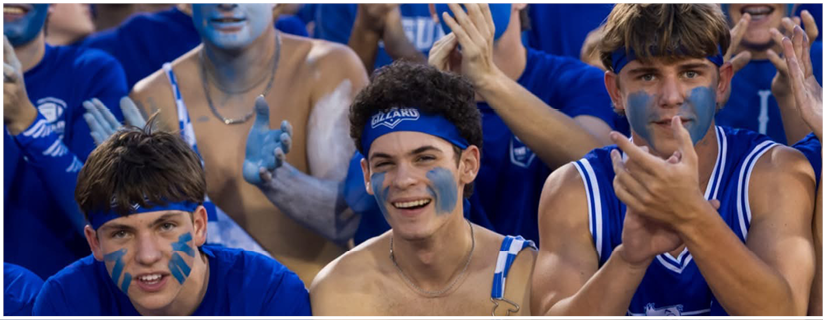 A football player wearing a blue and white uniform. Description generated by AI