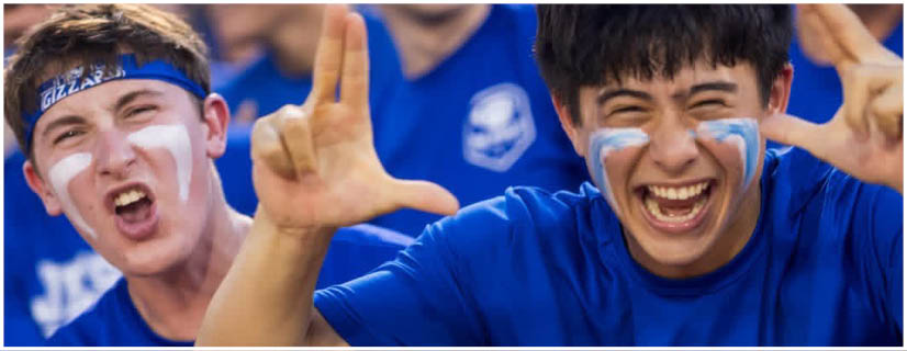 A football player wearing a blue and white uniform. Description generated by AI