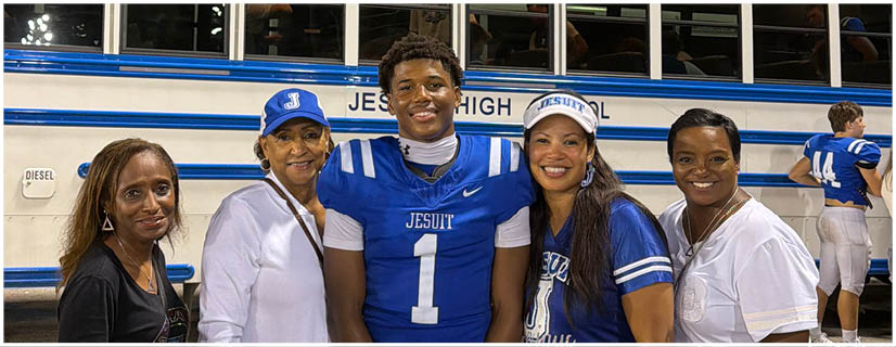 A football player wearing a blue and white uniform. Description generated by AI