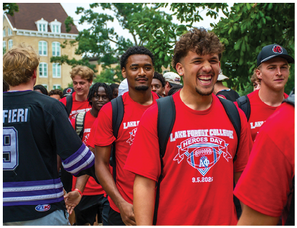 A group of people wearing red shirts. Description generated by AI