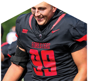 A football player wearing a black and red jersey with the number 9 on it. Description generated by AI