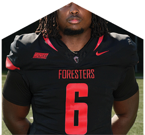 A football player wearing a black jersey with the number 6 on it. Description generated by AI
